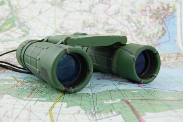 Land and Expand binoculars and map